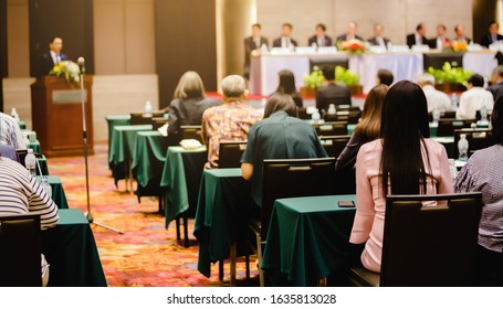 BANGKOK, THAILAND - Jan 31, 2020 : Selective Focus To Business Woman Sitting With Blurry Chairman Of Executive Committee In Auditorium For Shareholders Meeting Or Seminar Event, Annual Meeting.