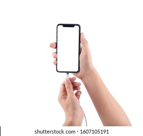 Bangkok, Thailand - Jan 5, 2020: Studio shot of Smartphone iPhone 11 Pro Hand connecting charger to smartphone isolated on white background