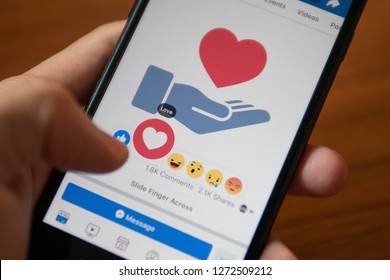 Bangkok, Thailand - January 1, 2019 : Facebook User Touch On Love Button In Facebook Application On IPhone 7.