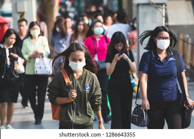 Bangkok, Thailand - January 14, 2019 :Unidentified people wearing mouth mask against air smog pollution with PM 2.5 walking on street at chatuchak district in  Bangkok city, Thailand.