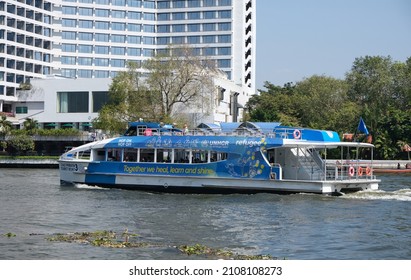 BANGKOK, THAILAND - JANUARY 15, 2022: A tourist boat goes up the Chao Phraya River on January 15, 2022 in Thai capital Bangkok