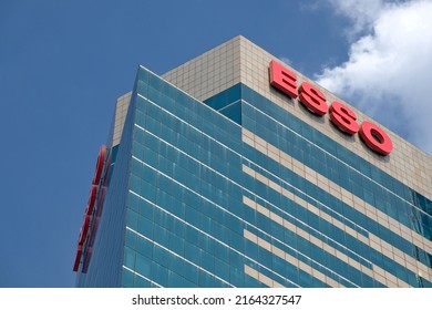 BANGKOK, THAILAND - JANUARY 16, 2022: Esso Tower Soars Into Blue Sky On January 16, 2022 In Thai Capital Bangkok