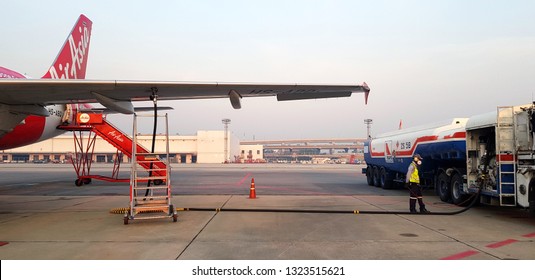 Bangkok, Thailand - January 21, 2019: The Worker, Technician Or Engineer Filling Oil, Fuel Or Gasoline From Refuel Truck To Airplane At Runway, Donmuang Airport, Bangkok, Thailand - Transportation 