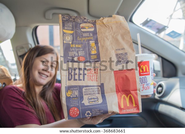 BANGKOK,\
THAILAND - January 25, 2016: McDonalds Meal on a stret background\
near the restaurant for eating in the\
car