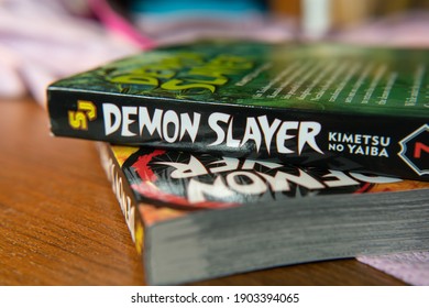 Bangkok, Thailand - January 26, 2021 : Kimetsu no Yaiba or Demon Slayer comic books on the table.