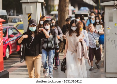 Bangkok, Thailand - January 27, 2020 : Unidentified People  Mouth Mask Against Air Smog Pollution PM 2.5 And Coronavirus Walking On Street At Chatuchak District In  Bangkok City, Thailand.