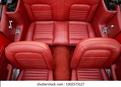 BANGKOK, THAILAND - JANUARY 28, 2019: Top view of Ford Mustang convertible classic red leather upholstery interior front & back seat. Illustration of vintage car restoration and car detailing.