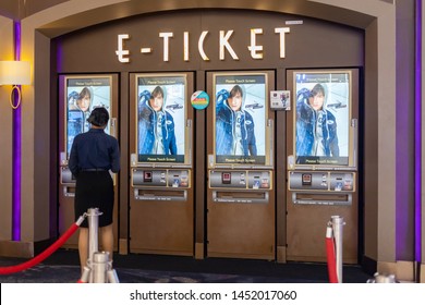 Bangkok, Thailand, Jul 14, 2019 - Woman Buying Movie Ticket From Ticket Machine