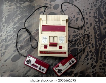 BANGKOK, THAILAND - July 06, 2021 : Retro Family Computer Game Is An 8-bit Third-Generation Home Video Game Console Produced By Nintendo, Nintendo First Released It In Japan As The Family Computer 