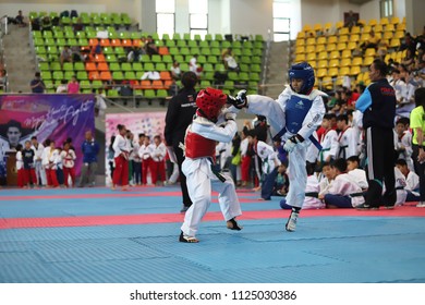 Bangkok, Thailand - July 1, 2018 : Taekwondo  Athlete from many countries fight together in fighting match of The 4th HEROES Taekwondo International Championship at AU Stadium, motion blur