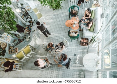 Bangkok, Thailand - July 10, 2017 : Top View Of Many Asian People Sit In Glass House Cafe For Have Lunch And Dessert.