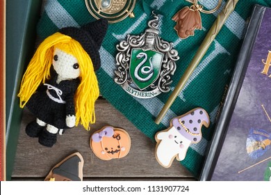 Bangkok, Thailand - July 11, 2018 : A Photo Of Merchandise From Harry Potter Movies With Selective Focus On The Slytherin Crest Metal Ornament. Slytherin Is 1 Of The 4 Houses In Hogwarts School.