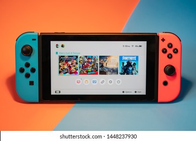 Bangkok, Thailand - July 11, 2019 : Nintendo Switch, the video game console on red and blue background.