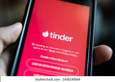 Bangkok, Thailand - July 22, 2019 : iPhone 7 showing its screen with Tinder application.