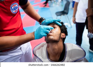 Bangkok, Thailand - July 27, 2019 ; Sport Event Named Heroes TaeKwonDo International Championship 2019. Nurse EMS First Aid Injuries Player Karate At Head Nose And Pain At Assumption University