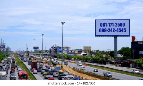 Bangkok, Thailand - July 31,2019 : Selective Focus At Large Outdoors Advertising Billboard With Various Vehicles On Highway In Traffic Jam During Long Holiday Season Time