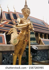 Bangkok, Thailand - July 6, 2009:  Statue of a golden kinnara (half human, half horse) at the Grand Palace
