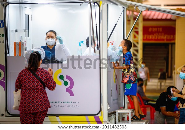BANGKOK, THAILAND – JULY 7:\
Doctors run off-site testing for COVID by using a car as an office\
to make it easier to reach patients on July 7, 2021 in Bangkok,\
Thailand.