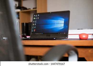 Bangkok, Thailand - July 9, 2019 : Laptop Computer Showing Its Screen With Microsoft Windows Logo On Desktop.