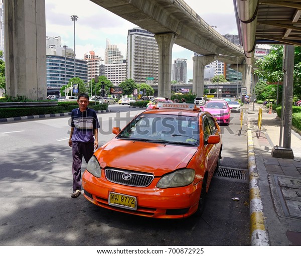 Bangkok, Thailand\
- Jun 17, 2017. A taxi parking on street at downtown in Bangkok,\
Thailand. Bangkok has a population of over 8 million or 12.6\
percent of the country\
population.