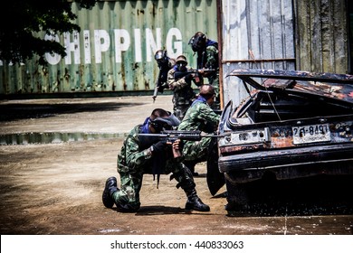 BANGKOK, THAILAND - JUN 21: BB gun player fighting on June 21, 2016 in shooting ground near Bangkok, Thailand. BB gun is a recreational activity with replica firearms. And dark tone.
