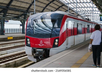 Bangkok, Thailand - June 15, 2022 - SRT Dark Red Line Train Stopping At Laksi Station.