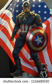 BANGKOK THAILAND - JUNE 16 ,2017 : Close up shot of Captain America Civil War superheros figure in action with America Flag, Captain america appearing in American comic books by Marvel.