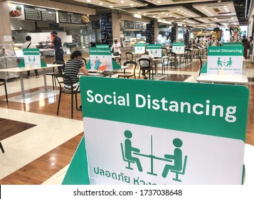 BANGKOK, THAILAND- June 21, 2020: Social Distancing For COVID-19 Disease Pandemic Prevention In Tesco Lotus Food Court Dining Table Public Area For Keeping People Distance