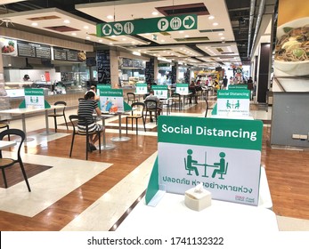 BANGKOK, THAILAND- June 21, 2020: Social Distancing For COVID-19 Disease Pandemic Prevention In Tesco Lotus Food Court Dining Table Public Area For Keeping People Distance