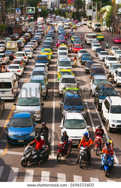 Bangkok, Thailand - June 22, 2019 :  Traffic\
moment in afternoon on Asoke junction at downtown of Bangkok,\
Thailand - Vintage\
filter
