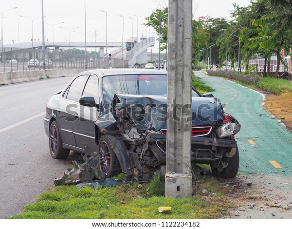 Bangkok, Thailand June 27, 2018: Car\
accident with electric pole. The damage in front of\
car.