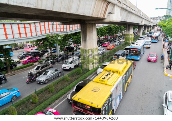 BANGKOK,\
THAILAND - JUNE 28, 2019 :Traffic jam rush hour in rain cloud day \
and Friday at the end of the month at  BTS chatuchak station\
phahonyothin road chatuchak Bangkok,\
Thailand.