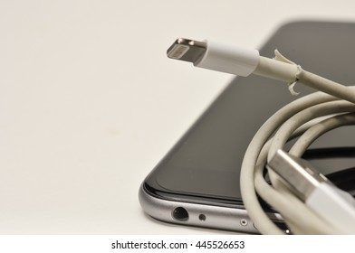 BANGKOK, THAILAND -  JUNE 30, 2016 : The Broken IPhone Charger Cable. Focus On Damaged Part.