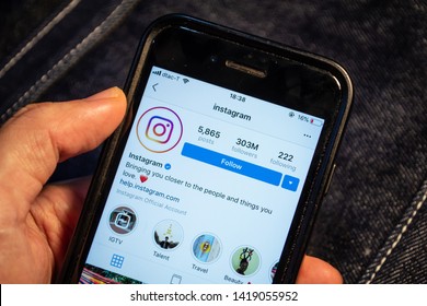 Bangkok, Thailand - June 7, 2019 : Apple iPhone 7 held in one hand showing its screen with Instagram application.