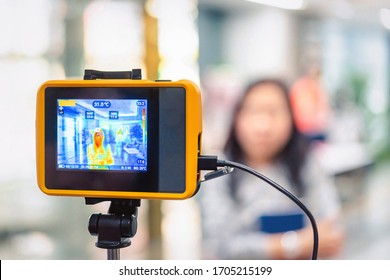 Bangkok, Thailand - March 13, 2020 : Unidentified people waiting body temperature check to access building for against epidemic flu covid19 or corona virus by thermoscan or infrared thermal camera