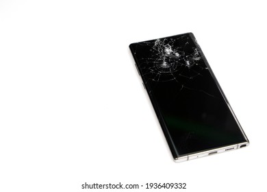 Bangkok, Thailand: March 14, 2021 - Close-up of a Samsung Galaxy Note isolated on a white background, it fell and the screen was cracked.