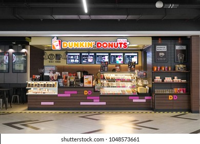 Bangkok, Thailand - March 17, 2018 : A photo of Dunkin' Donuts shop inside the metro mall (Bangkok Underground) with selective focus on the Dunkin' Donuts logo on top. Editorial use only.