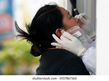 Bangkok Thailand - March 17 2021 A Thai Woman Receives Nasal Swap Test For Covid-19