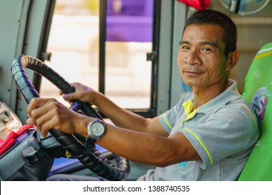 Bangkok, Thailand - March 18, 2019: Portrait of tourists minibus driver
