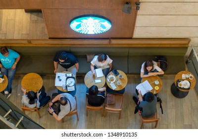 Bangkok, Thailand - March 20, 2019. Customers At The Starbucks Coffee In Shopping Mall. Top View.