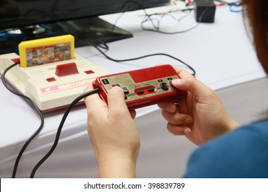 Bangkok, Thailand - March 2016 : People Playing Old Family Computer Game