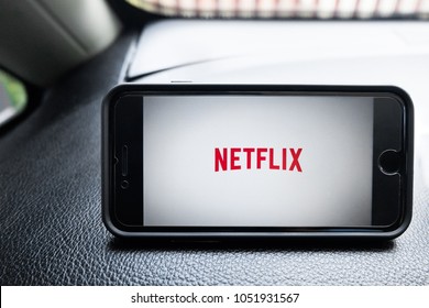 Bangkok, Thailand - March 22, 2018: Netflix And Chill, Netflix Open On An IPhone Sitting On The Dash Of A Car
