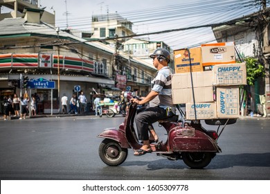 Bangkok, Thailand - March 24, 2017: An unidentified man riding an old Vespa moped.