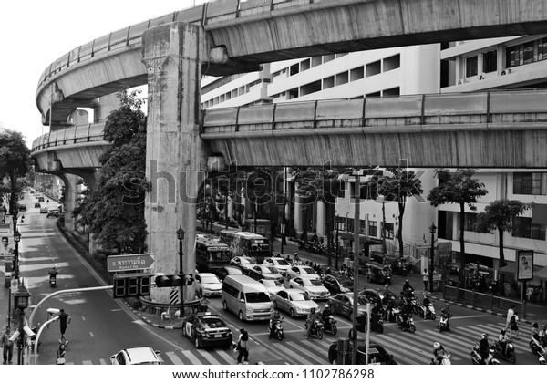 Bangkok, Thailand - March 28, 2018: A black and\
white landscape image of Bangkok traffic. This is one of the most\
congested cities in the world.\
