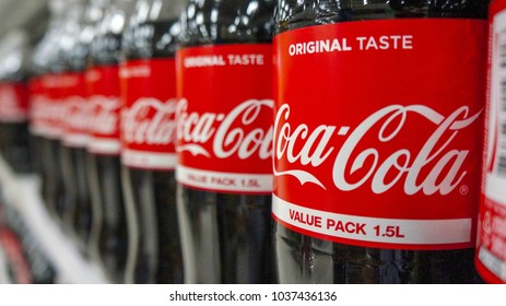BANGKOK, THAILAND - MARCH 3, 2018: Coca-Cola logo printed on bottle and placed on shopping mall. Coca-Cola is a carbonated soft drink sold in stores and restaurants throughout the world.