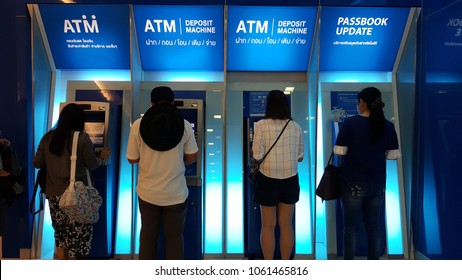 BANGKOK, THAILAND - MARCH 31, 2018: Unknown Customers Using At ATM Deposit Machine And Automatic Passbook Printing Machine During Pay Day At TMB Bank.