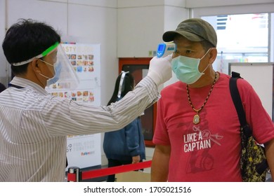 Bangkok, Thailand - March 31, 2020 : Department Store Takes Temperature Check Of Customer For Fever At The Entrance In Response To The COVID-19 Pandemic.