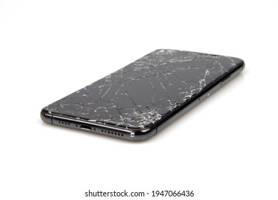 Bangkok, Thailand: March 31, 2021 Photo of Apple iPhone 11 Pro Max, a modern smartphone with damaged glass screen. On a white background Equipment waiting for repair