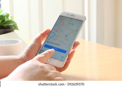BANGKOK, THAILAND - MARCH  4 th, 2017 : Woman holding on Google Maps application on new  Apple iPhone 7 plus. Google Maps is most popular mapping service for mobile provided by Google. - Shutterstock ID 592639370