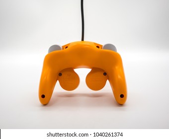 Bangkok, Thailand - March 7, 2018: Nintendo Gamecube Controller In Orange Color, Vintage Portable Game By Nintendo. Illustrative, Editorial.